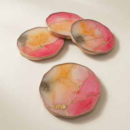 Pink quartz and tangerine kintsugi epoxy coasters with gold accent
