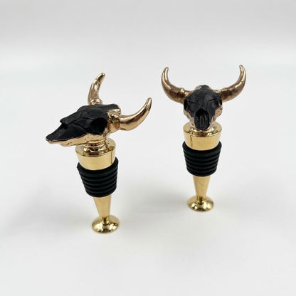 Black longhorn skull wine stopper with gold horns on chrome stem