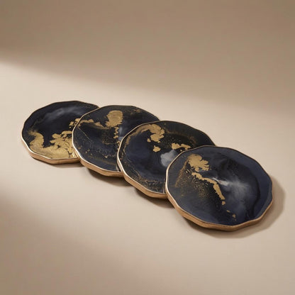 Black and gold epoxy resin coasters with gilded edge, set of four